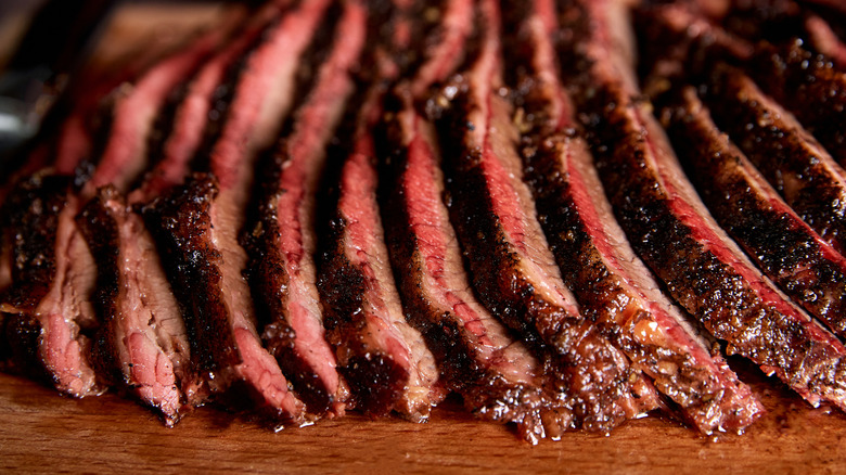 Slices of beef brisket on a cutting board