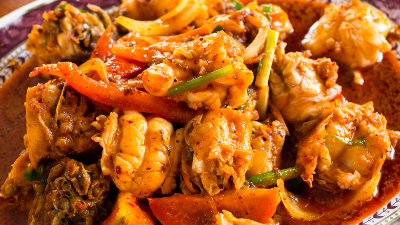 Lobster tails cooked in spicy paste with vegetables