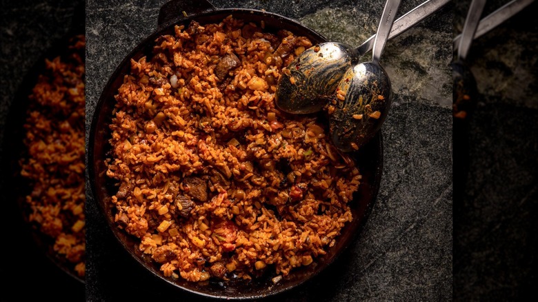 Platter with spicy-looking stew and two spoons