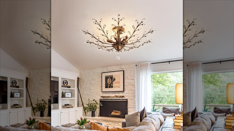 A brass and crystal chandelier hanging in a living room