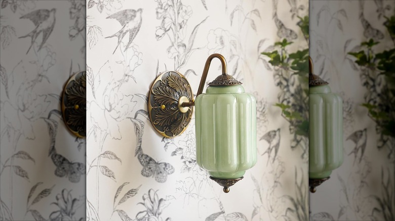 A vintage-style green milk glass wall sconce