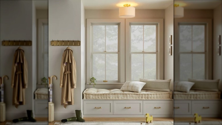 A flush-mount light fixture mounted over a window seat