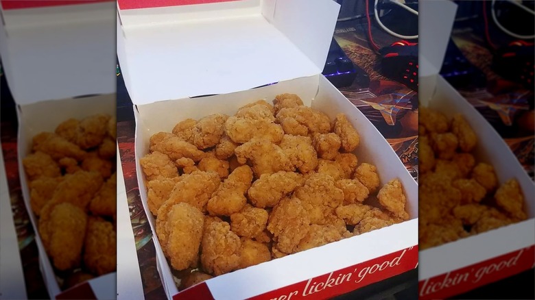 Cardboard box of KFC popcorn chicken
