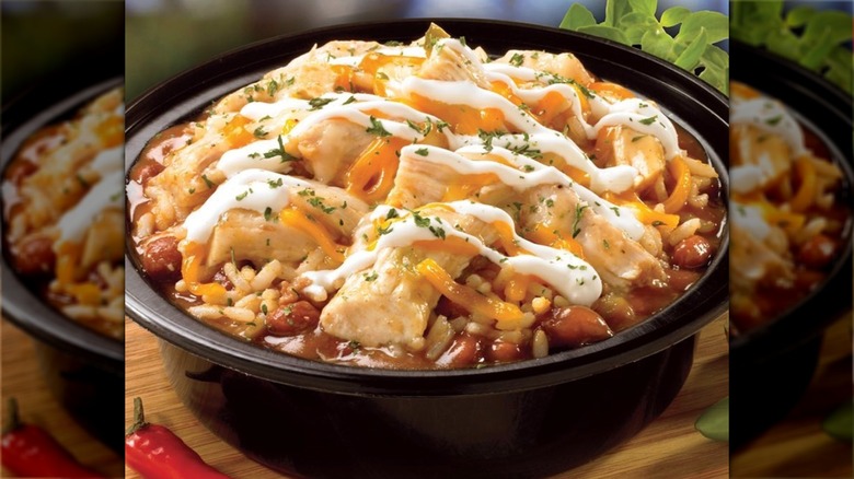 Big Easy chicken bowl in black container on wood table