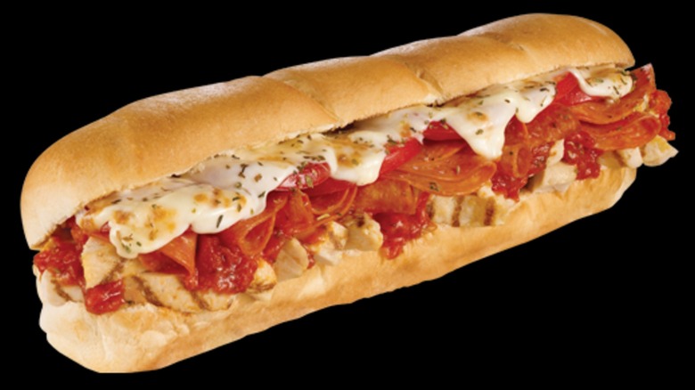 Subway Chicken Pizziola sandwich on a black background