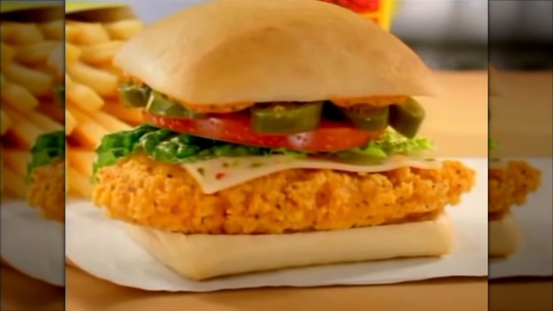 Wendy's spicy chicken sandwich on wooden table