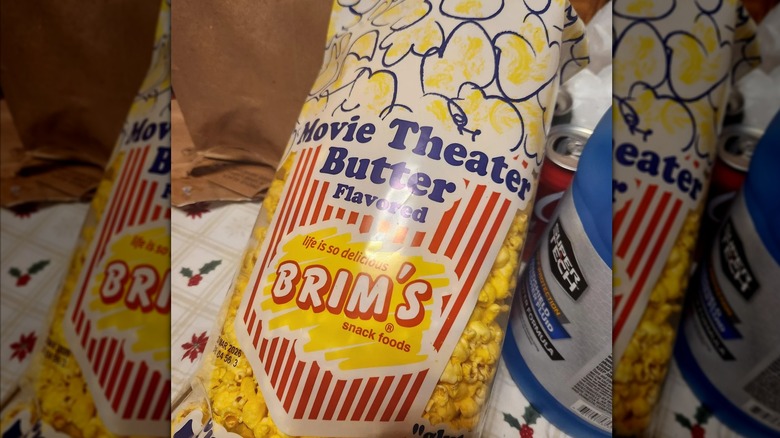 A bag of Brim's Movie Theater Butter Flavored popcorn sits on a table.
