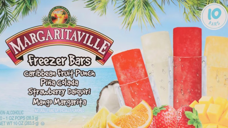 A box of Margaritaville Freezer Bars showing four fruit flavors in front of a beach