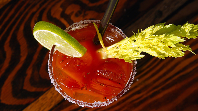 Overhead view of a Bloody Mary with garnishes