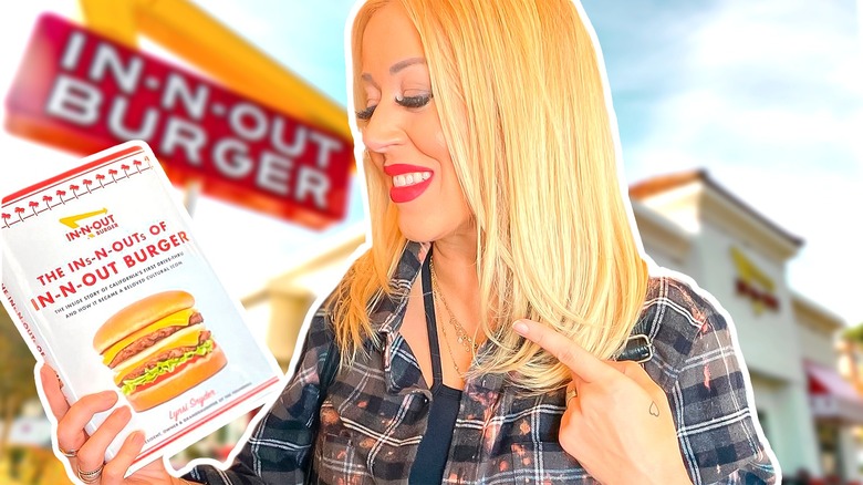 Lynsi Snyder holding the In-N-Out Book she wrote