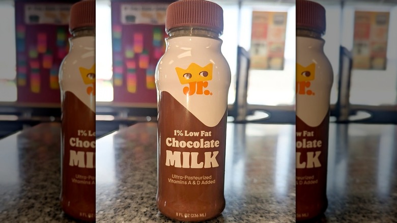 A bottle of Burger King 1% low fat chocolate milk sitting on a counter
