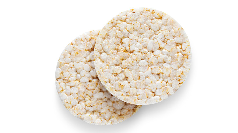 Two rice cakes against a white background