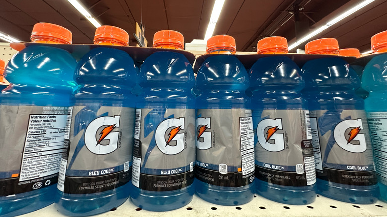 Bottles of blue Gatorade on a store shelf