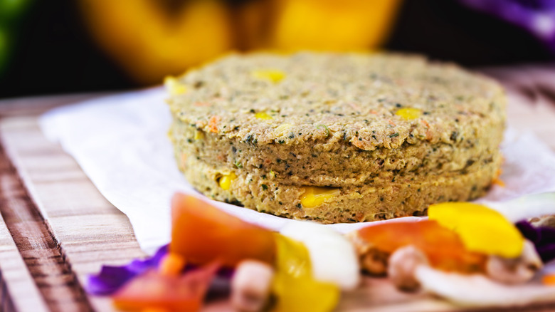 Veggie burger patties on a wooden board