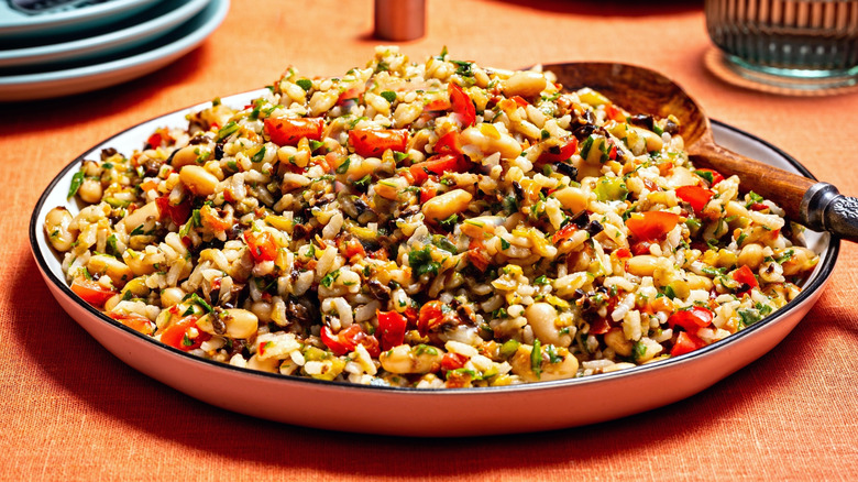 plate of succotash on a wooden table