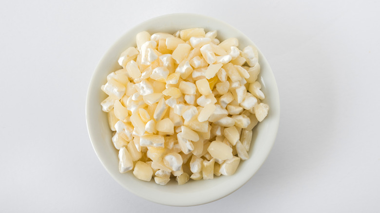 Uncooked Hominy in a white bowl