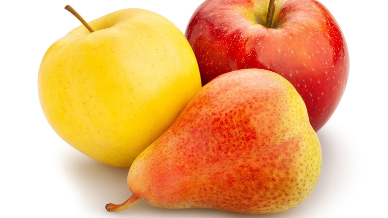 Close up of two apples and one pear