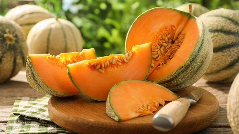 Fresh cut cantaloupe on a cutting board