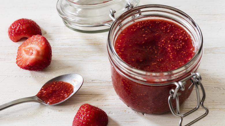 raspberry jam with spoon and fruit