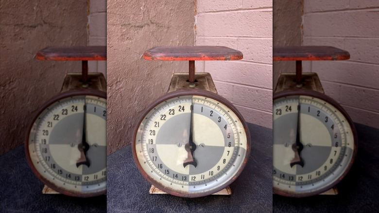 Close-up of an old worn antique kitchen scale