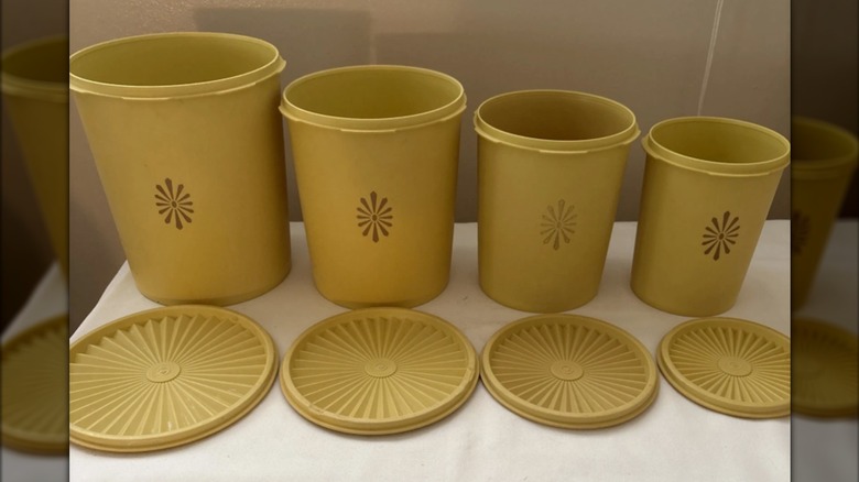 Quartet of vintage yellow Tupperware canisters