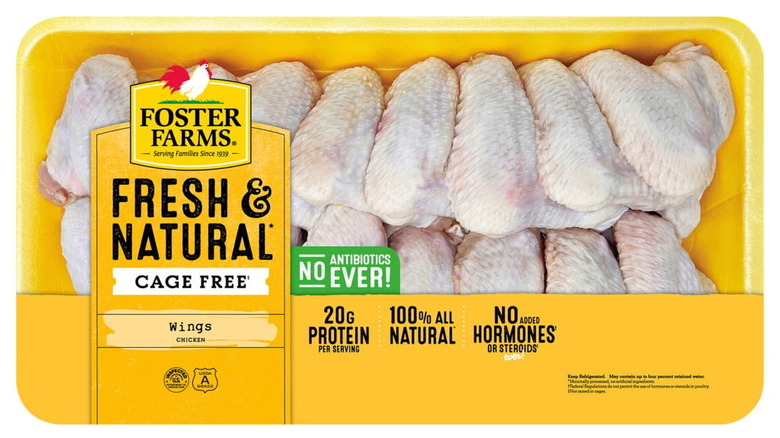 A package of Foster Farms Fresh & Natural cage-free chicken wings on white background