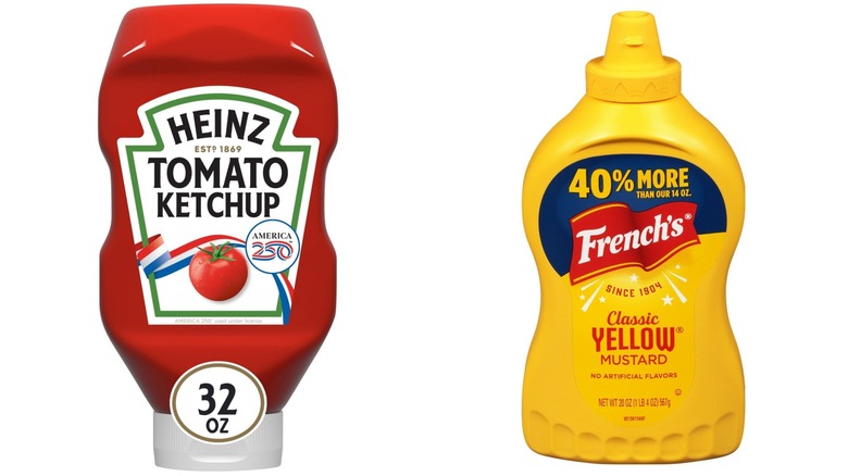 Bottles of Heinz Tomato Ketchup and French's Kosher Classic Yellow Mustard on white background