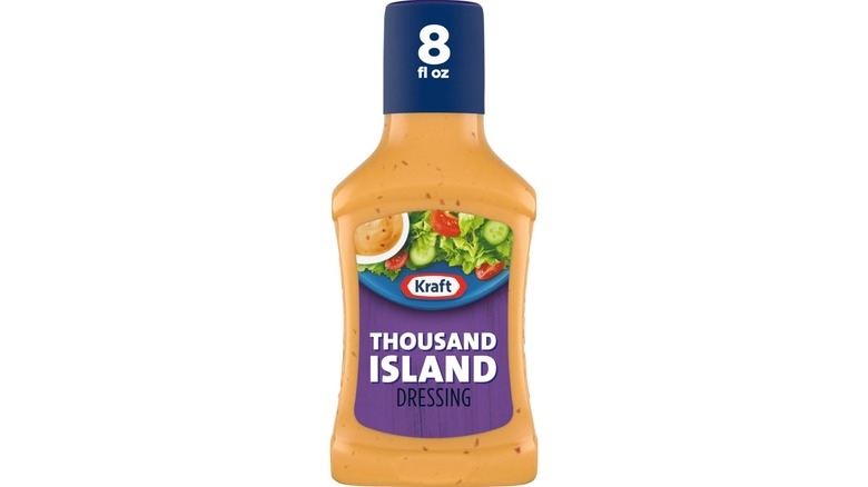 A bottle of Kraft Thousand Island Dressing on white background