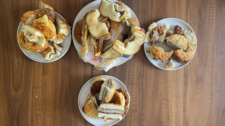 Several plates full of Hardee's Breakfast sandwiches