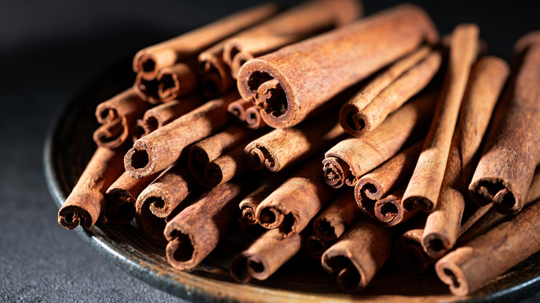 A plate piled with cinnamon sticks