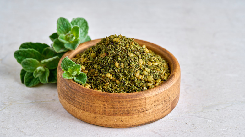 A wooden bowl filled with za'atar