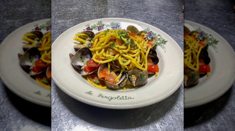close up on a plate of pasta with clams