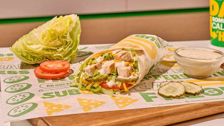 Peppercorn Ranch Chicken Protein Pocket from Subway on cutting board with pickles and sauce