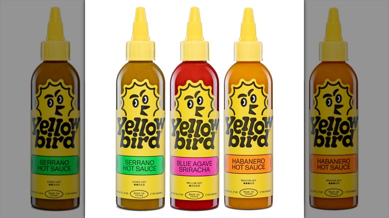 Three bottles of Yellow Bird hot sauce