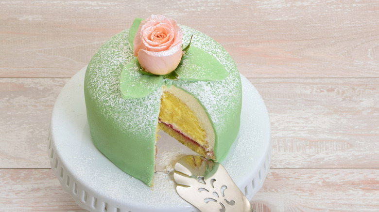Princess cake with slice cut