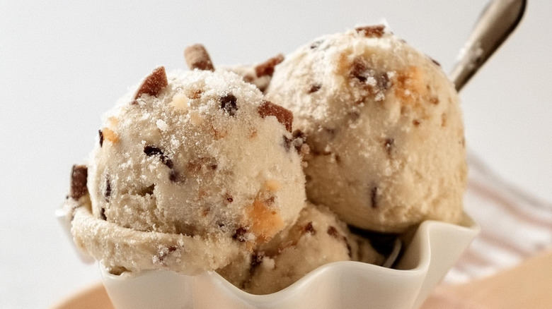 Scoops of butter pecan in a bowl