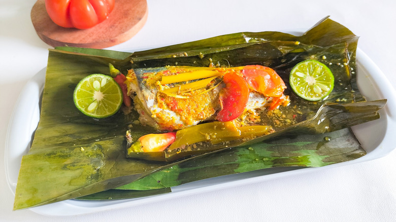 Indonesian Pepes Ikan fish dish served wrapped in a banana leaf