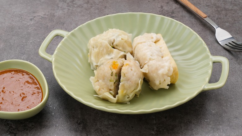 Plate of Siomay Bandung fish dumplings with spicy sauce
