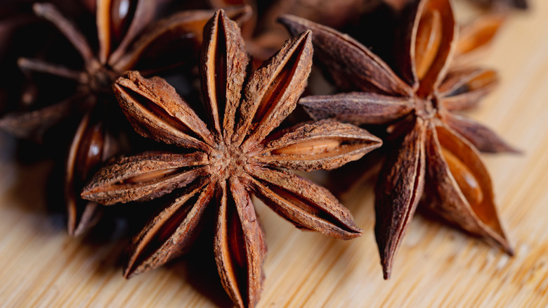Star anise on wooden board