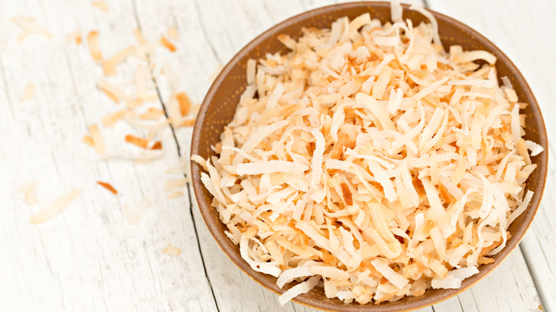 Shredded toasted coconut in bowl