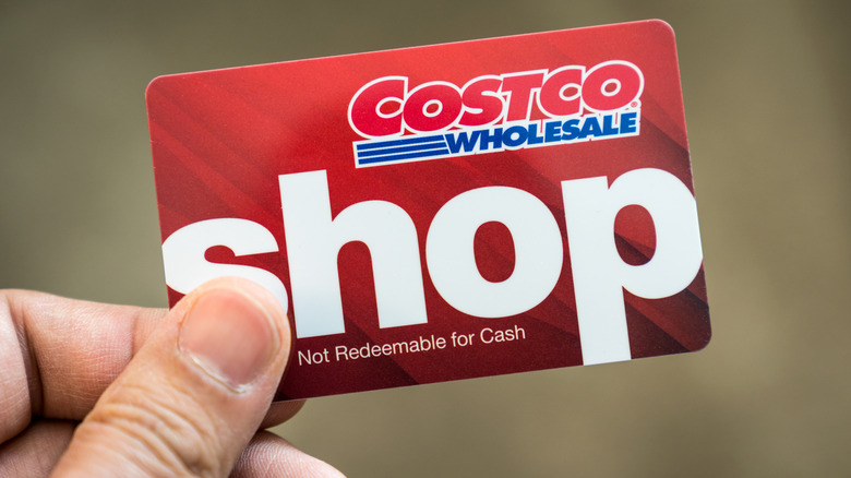Person holding Costco cash card