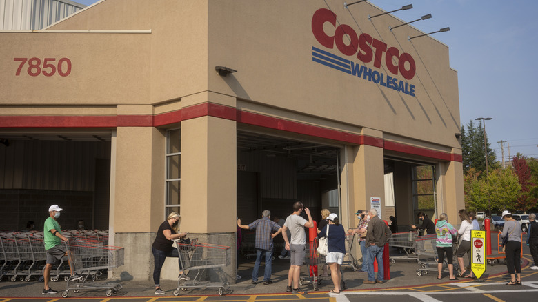 A group of people walking into Costco