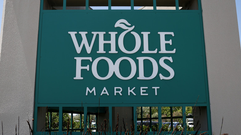 Green Whole Foods market sign outside