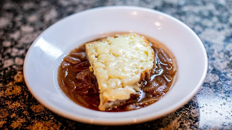 white plate of French onion soup
