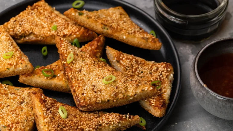 black plate of Fried Shrimp Toast