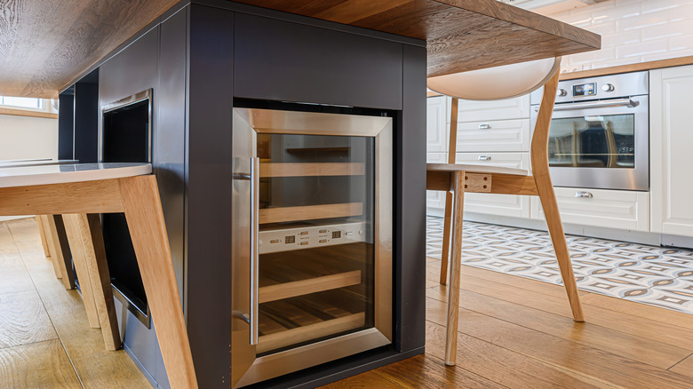 Mini refrigerator with beverages against an isolated white background