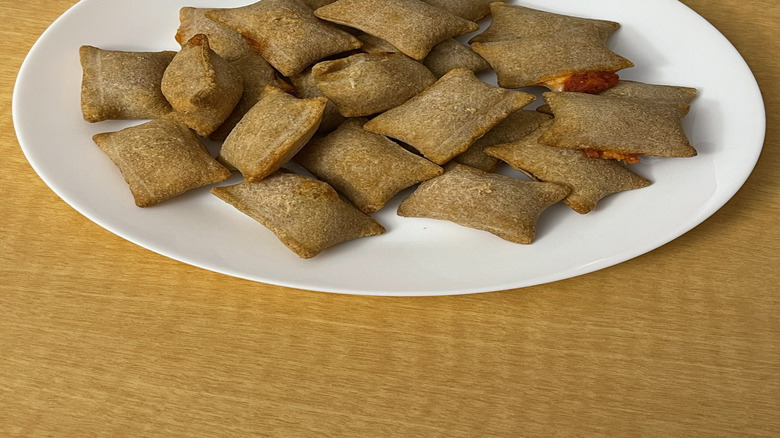 Pizza rolls on a white plate