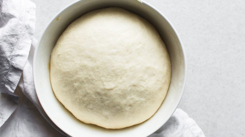 Bread dough rising in bowl