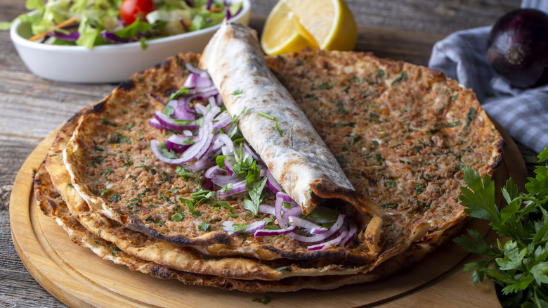 Stack of lahmacun on wooden board