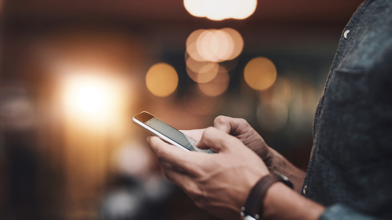 man on his phone in a restaurant